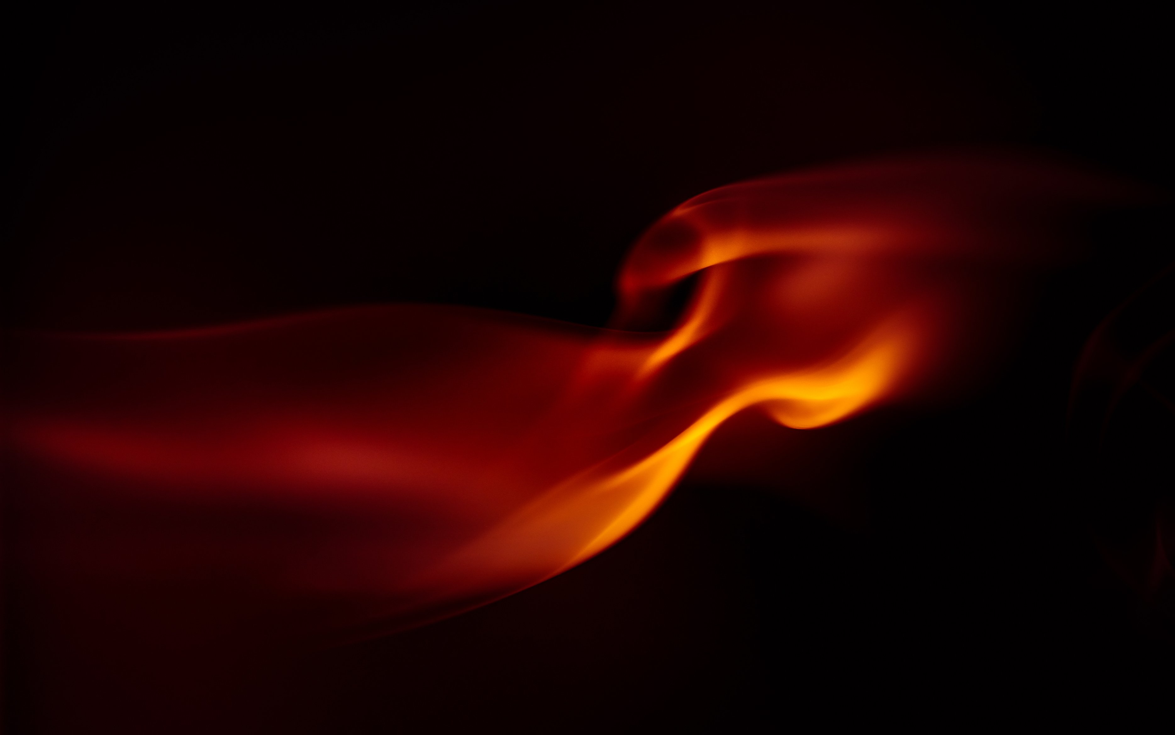 A Red Flame in a Dark Background